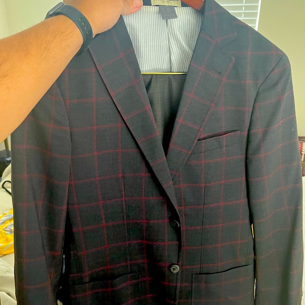 Dark gray sportscoat, with red window pane.